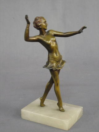 An Art Deco gilt painted spelter figure of a standing walking girl, raised on a square marble base 8"