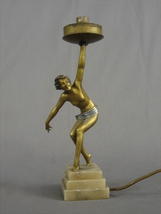 A spelter Art Deco style table lamp in the form of a standing lady, raised on a stepped marble base 13" (no shade)