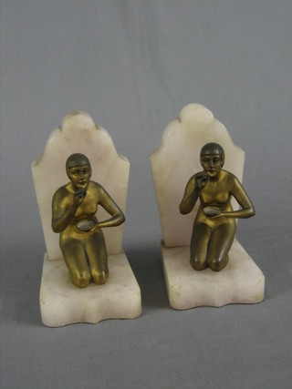 A pair of Art Deco gilt painted spelter and marble book ends in the form of kneeling ladies with bubble pipes 6" (1 f)