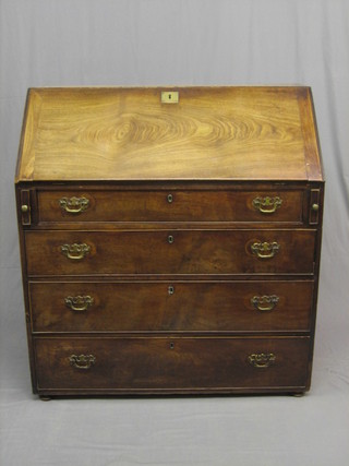 A Georgian mahogany bureau with fall front revealing a well fitted interior with brass escutcheon, above 4 long graduated drawers with brass swan neck drop handles, raised on bun feet 43" (formerly the bottom of a bureau bookcase)