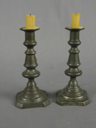 A pair of 18th/19th Century pewter candlesticks with touch mark to base and marked B and P X, 8"