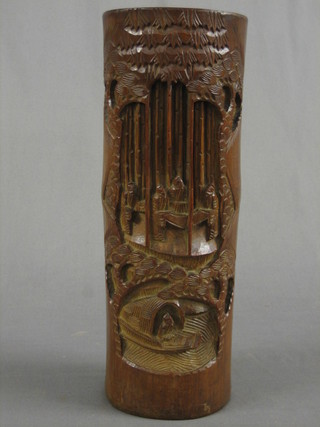 An oval carved Eastern bamboo vase in the form a Deity 13"