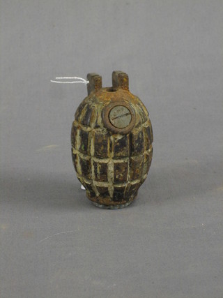 A Mills bomb (no pin, clip or spring)