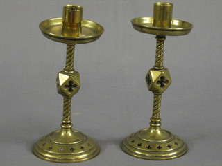 A pair of 19th Century brass Gothic style candlesticks 7" (1 bent)