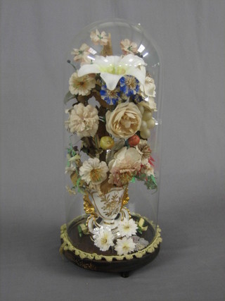 A Victorian porcelain vase with arrangement of flowers, contained under a glass dome 15"