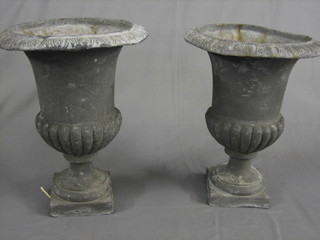 A pair of Victorian style cast lead urns of campanular form 14"