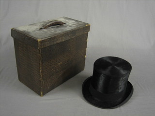 A gentleman's black silk top hat by C A Bunn & Co, size 7 contained in a fibre carrying case