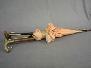 A bundle of walking sticks and umbrellas