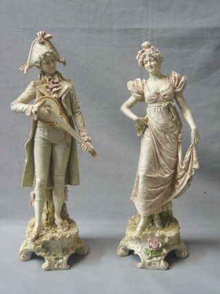 A pair of Royal Dux figures, standing gentleman minstrel and lady, the base with red triangular Royal Dux mark, incised 118 (lady's finger fan chipped) 17"