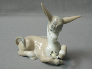 A Lladro figure of a seated donkey, the base marked A17E 5"