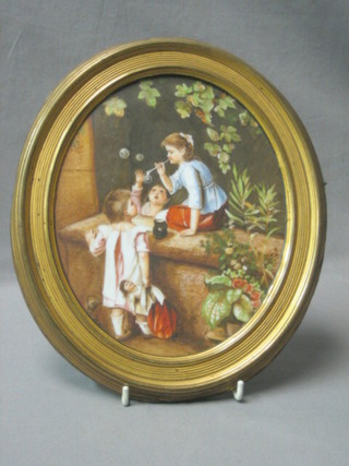 A 19th Century  Continental oval porcelain plaque depicting a seated girl within a garden blowing bubbles, the reverse incised KT, contained in a gilt frame 11"
