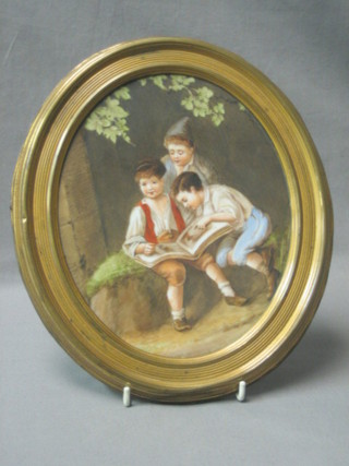 A 19th Century  Continental oval porcelain plaque depicting  seated boy  with a book, the reverse incised KT, 10" oval contained in a gilt frame