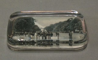 A rectangular glass paperweight the back decorated a black and white photograph of Rotton Row Carriage Drive and another Seaside Resort
