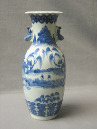 A 19th Century Oriental blue and white club shaped vase with dragon handles, the body decorated landscape, figures, bridges and pagodas, the base with 4 character mark 12"