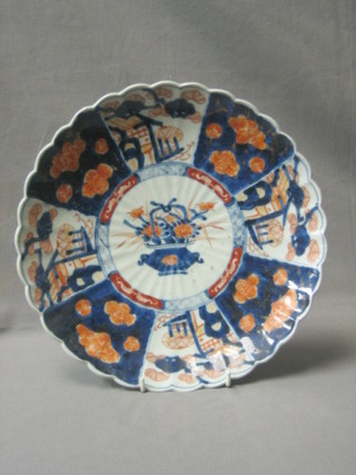 A 19th Century Japanese Imari porcelain plate with panel decoration and lobed borders 12"