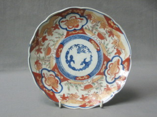 A Japanese Imari porcelain bowl with lobed border and panel decoration 8"