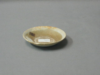 A circular saucer, some encrustations 3"