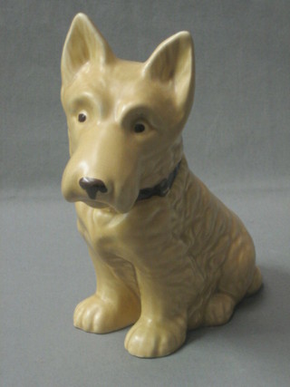 A Sylvac figure of a seated brown dog, the base marked Made in England RD778504, 7"