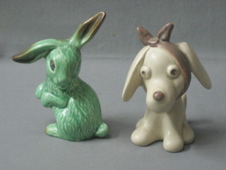 A brown glazed Sylvac figure of a seated dog with bandaged head, the base with paper Sylvac mark 5" and a green glazed figure of a seated rabbit 5" (f)