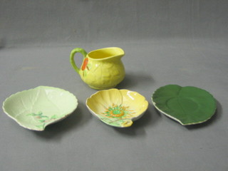 A circular leaf shaped Carltonware dish 5" (slight chip), 1 other (f and r) and a leaf shaped sauce boat stand 5" (chipped) and a Venton ware pottery jug 2"