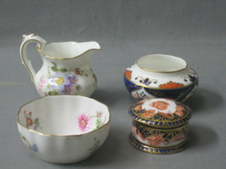 A circular Royal Crown Derby jar and cover, the base marked 1009S, 2", an 18th/19th Century circular Derby pot 3" and a Derby posy pattern miniature sugar bowl and cream jug