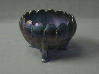 A purple Carnival glass bowl with scalloped border raised on 3 stump feet 5"