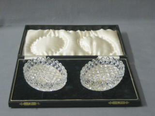 A pair of cut glass oval butter dishes, 4" cased