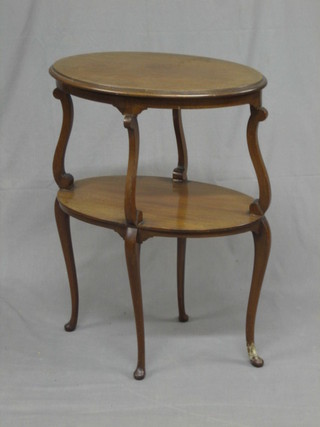 An Edwardian oval mahogany 2 tier occasional table, raised on cabriole supports 21" (1 foot with old repair)