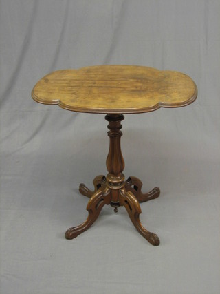 A Victorian Continental oval shaped occasional table, raised on a turned column with pierced tripod supports 28" (crack to top)