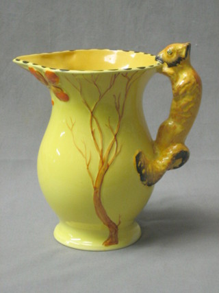 A Burleighware yellow glazed pottery jug decorated a stylised tree with squirrel handle 7"