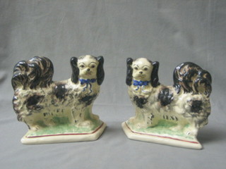 A pair of Staffordshire style figures of walking cats 8"