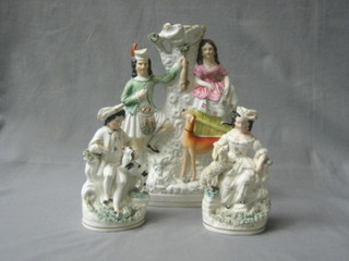 A 19th Century Staffordshire spill vase in the form of a standing huntsman 10" together with a pair of Staffordshire figures of a seated boy and girl with dogs and sheep (all f)