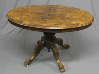 A Victorian inlaid figured walnut Loo table, raised on carved claw and tripod supports 46" (top damaged)