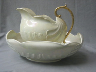 An oval Shelley shell shaped wash bowl 17" (cracked), a soap dish and cover and a pottery jug 10" (cracked)