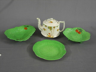 An Art Deco teapot with stylised floral decoration (spout chipped, lid cracked), a green leaf straining dish and 1 other green dish