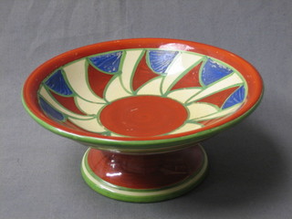 A Clarice Cliff Bizarre pedestal bowl with stylised decoration to the bowl and banding to the outside (severely rubbed)