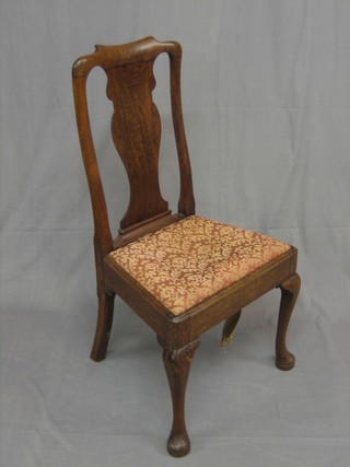 A Georgian mahogany splat back dining chair with upholstered drop in seat raised on cabriole supports