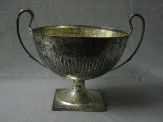 A handsome silver twin handled presentation cup raised on a square base, Sheffield 1919 53 ozs (inscribed)