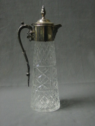 A modern cylindrical cut glass claret jug with silver collar