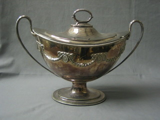 A large and impressive Georgian style silver plated twin handled soup tureen and cover with swag decoration, raised on a spreading foot