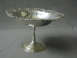 A circular silver pedestal fruit stand with pierced border, raised on a circular spreading foot, Sheffield 1919, 19 ozs (inscribed)