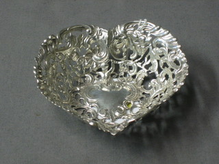 An Edwardian pierced silver heart shaped bon bon dish London 1900 4"