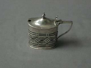 A Victorian oval pierced silver mustard pot Chester 1898 (some damage)