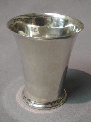 A silver beaker of waisted form, London 1913 by Harrods 4ozs