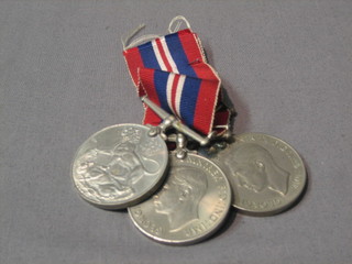 A 1939 British War medal and 2 Defence medals