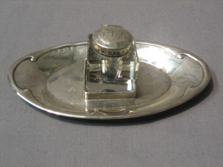 An Edwardian square cut glass inkwell mounted on an oval stand Chester 1906