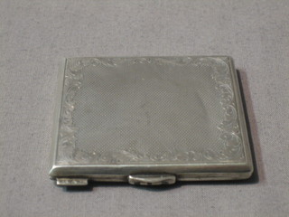 A Continental silver compact with engine turned decoration 2"