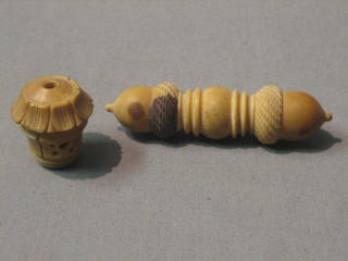 A carved "horn" needle case with acorn decoration 3" and a part needlecase