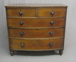 A 19th Century mahogany bow front chest of 2 short and 3 long drawers with tore handles, raised on turned supports 46"