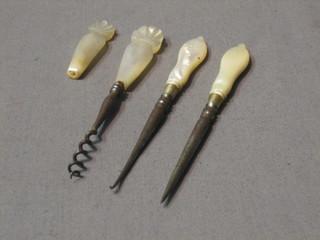 A Victorian steel scent bottle cork screw with carved mother of pearl handle and 2 other mother of pearl handled implements and 1 other m.o.p handle